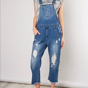 Darling woman’s denim distressed overall